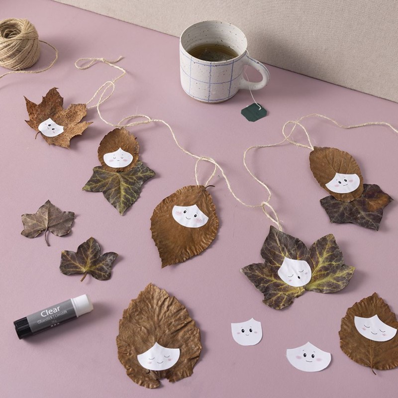 Herfstslinger maken met bladeren en gezichtjes